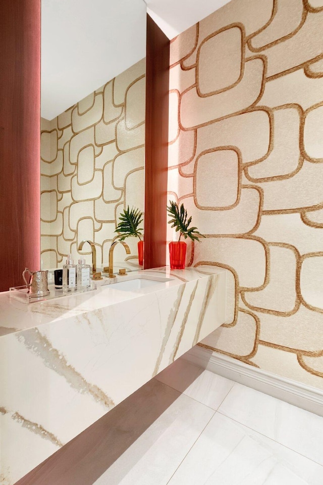 bathroom with a sink and tile patterned floors