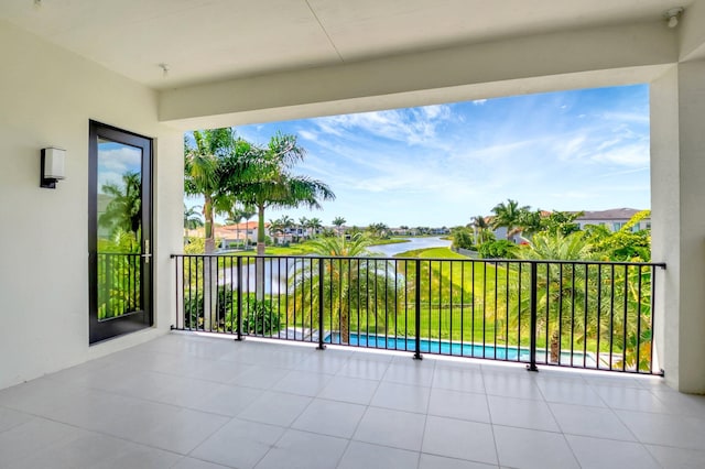 balcony featuring a water view