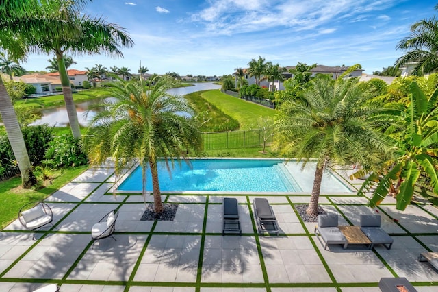 view of swimming pool with a water view, fence, a fenced in pool, and a patio