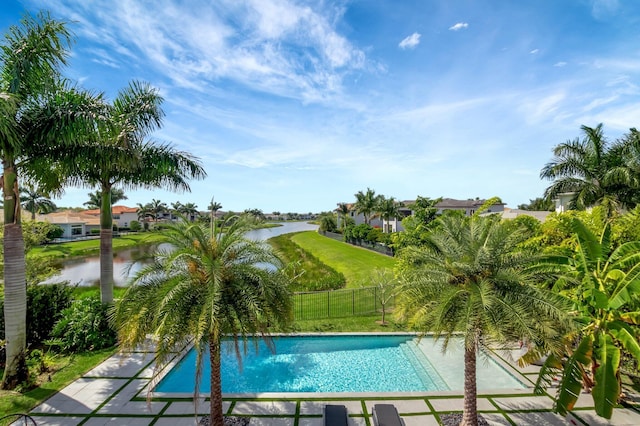 view of pool featuring a water view, a lawn, fence, and a fenced in pool