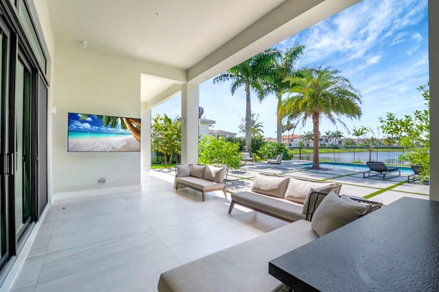 view of patio / terrace with outdoor lounge area and a fenced in pool