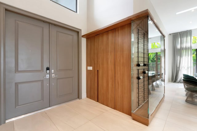 foyer entrance with tile patterned flooring