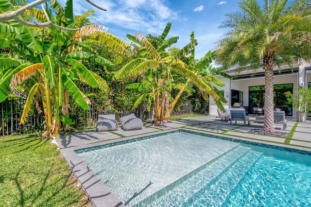 outdoor pool featuring a patio and fence