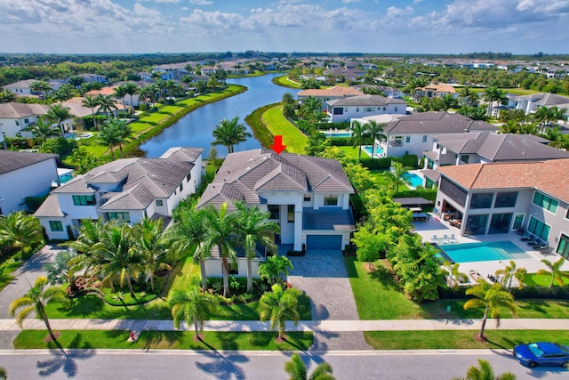 bird's eye view featuring a water view and a residential view