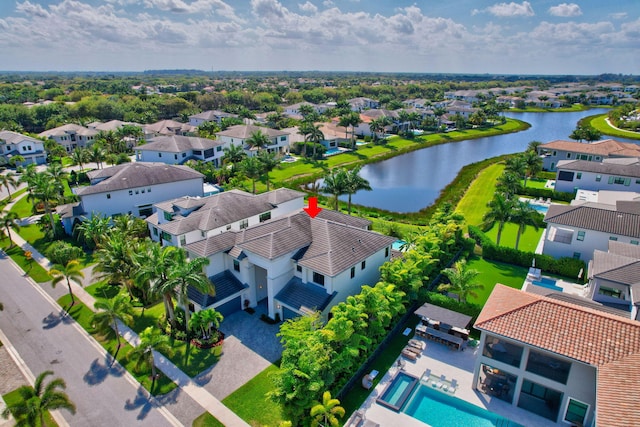 bird's eye view featuring a water view and a residential view