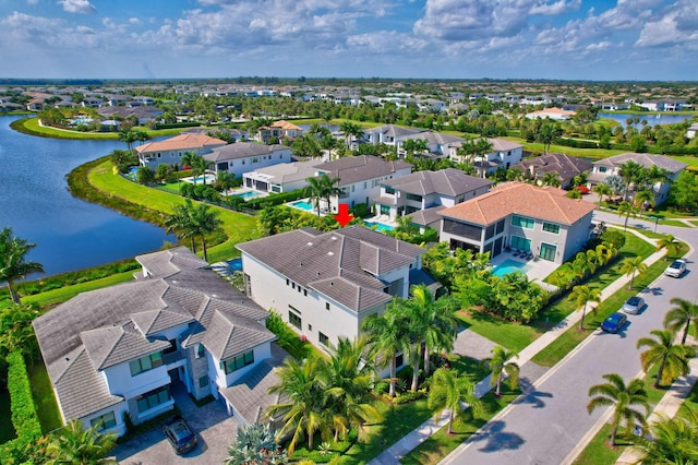 aerial view featuring a water view and a residential view