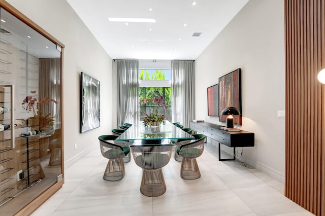 dining space featuring baseboards