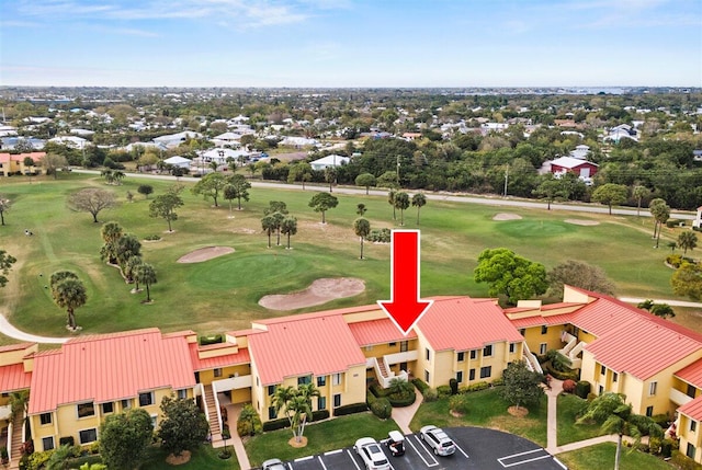 bird's eye view featuring view of golf course and a residential view