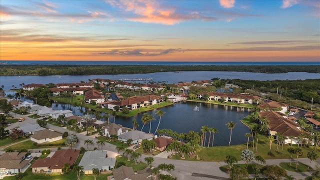 aerial view with a water view and a residential view