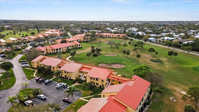 birds eye view of property with a residential view and golf course view