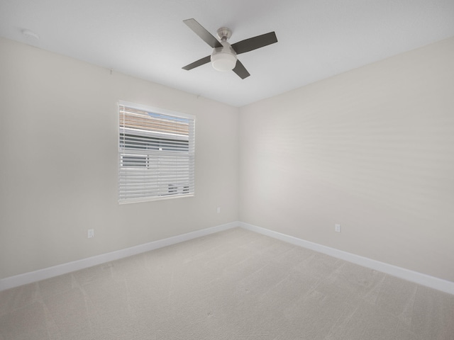 unfurnished room with ceiling fan, carpet, and baseboards