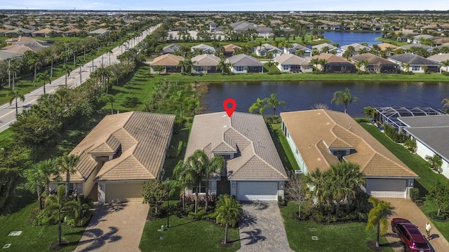 aerial view featuring a water view and a residential view