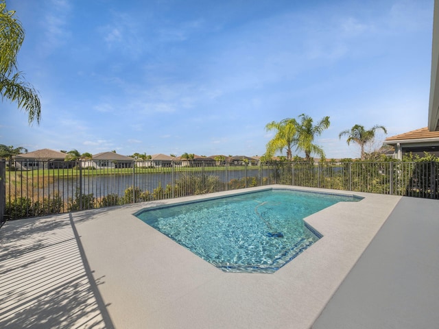 view of swimming pool with a fenced in pool, a patio area, a water view, and a fenced backyard