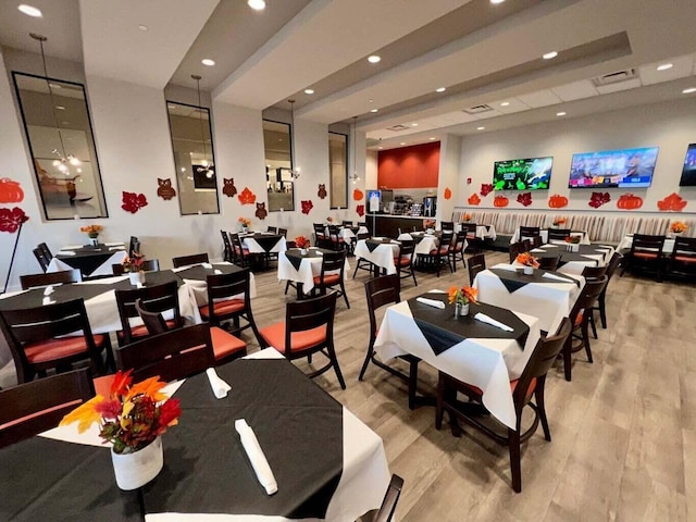 dining room featuring light wood-style flooring, visible vents, and recessed lighting