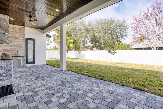 view of patio / terrace with area for grilling and ceiling fan