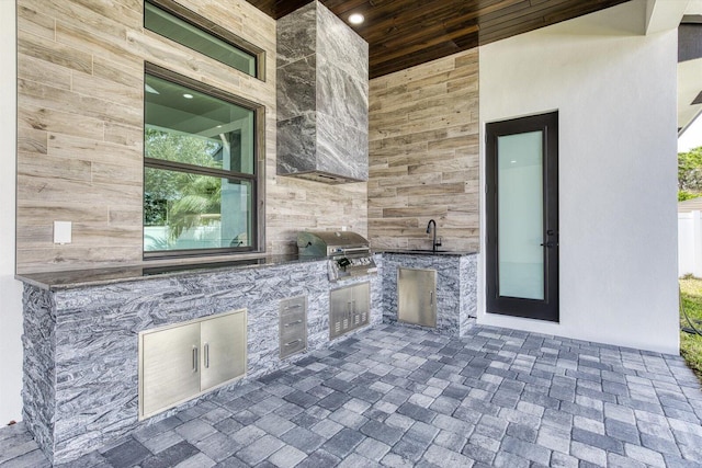 view of patio with sink, area for grilling, and an outdoor kitchen