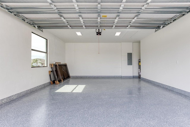 garage featuring electric panel and a garage door opener