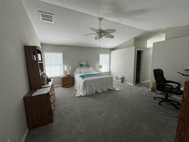 carpeted bedroom with lofted ceiling, multiple windows, a textured ceiling, and visible vents