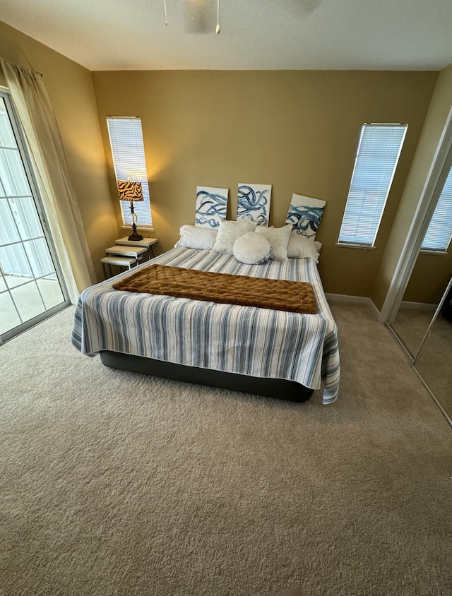 bedroom with carpet and baseboards