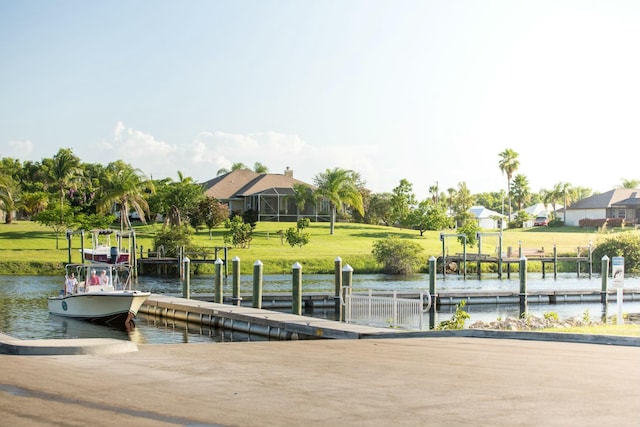 dock area featuring a yard and a water view