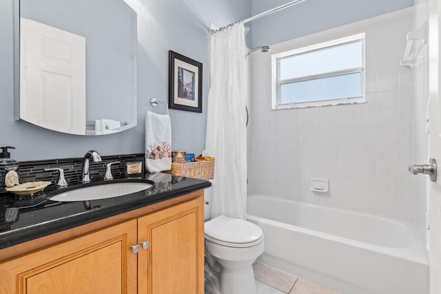 full bath featuring backsplash, toilet, shower / bath combo with shower curtain, vanity, and tile patterned flooring