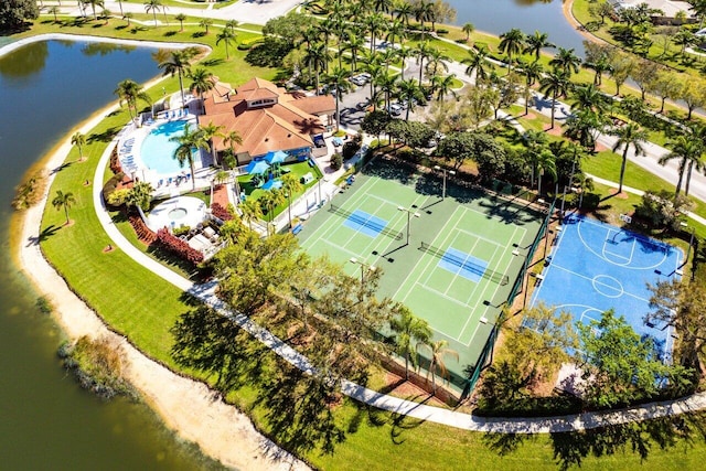 birds eye view of property with a water view