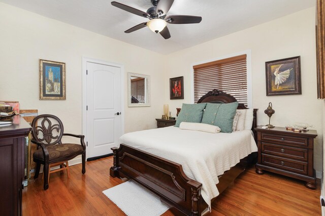 bedroom with wood finished floors and a ceiling fan