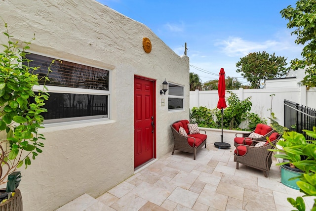 view of patio / terrace with fence and an outdoor living space