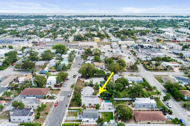 birds eye view of property with a residential view