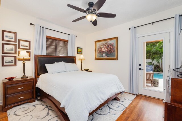 bedroom featuring access to exterior, a ceiling fan, and light wood-style floors