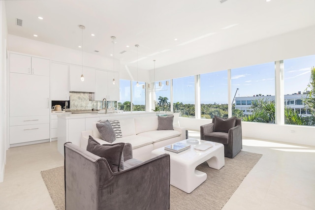 living area with visible vents and recessed lighting