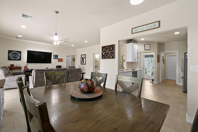 dining room featuring ceiling fan and light tile patterned floors