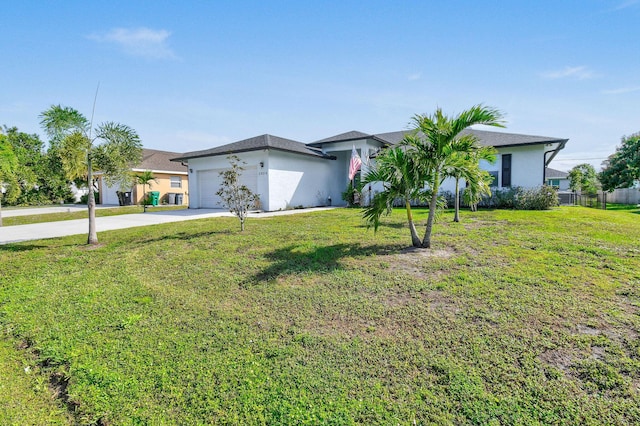 ranch-style home with a front yard and a garage