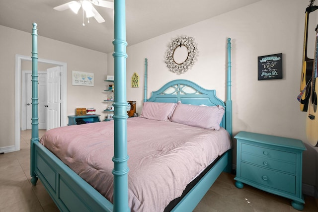 bedroom with ceiling fan and light tile patterned floors