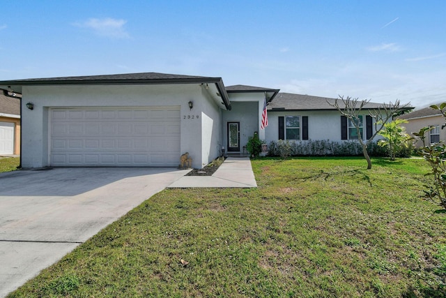 ranch-style home with a garage and a front yard