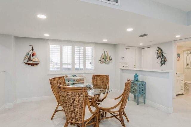 dining room with recessed lighting, visible vents, and baseboards