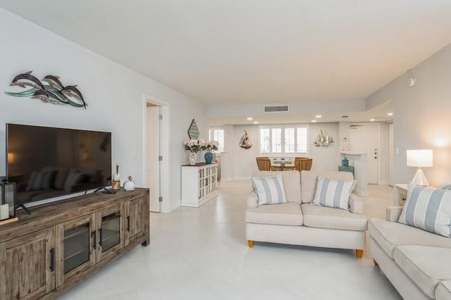 living area with visible vents and recessed lighting