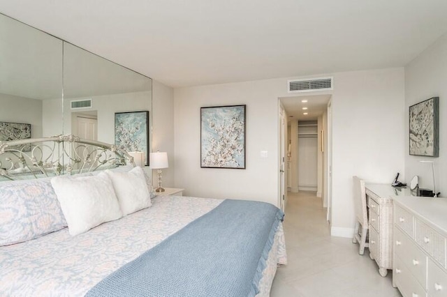 bedroom featuring visible vents and baseboards