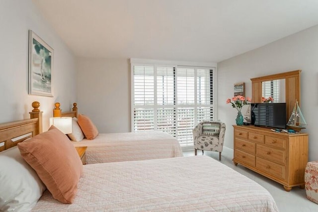 bedroom featuring light carpet