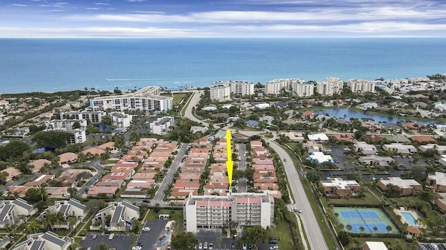 drone / aerial view with a water view and a view of city