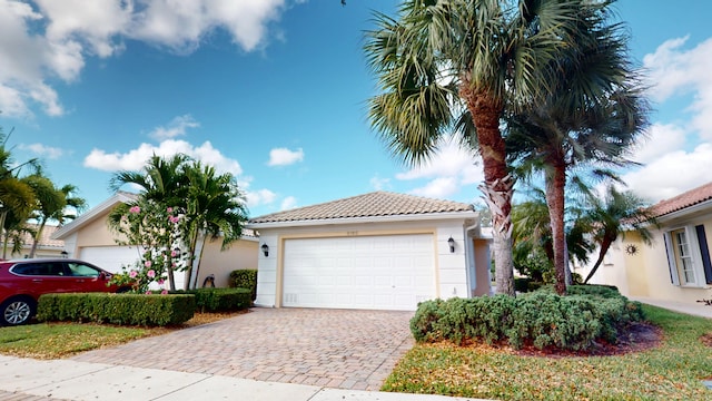 view of front of house with a tiled roof and stucco siding