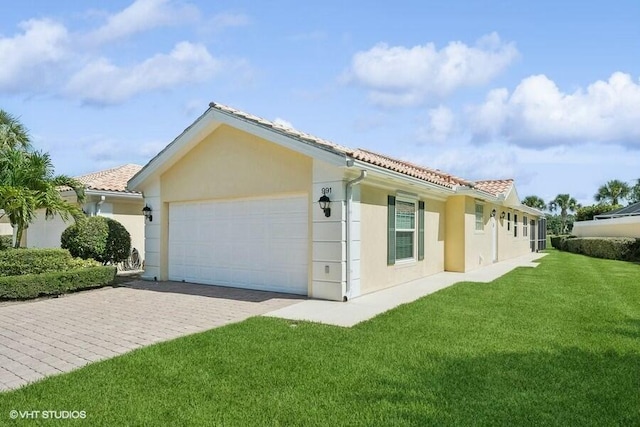 exterior space with a garage and a yard