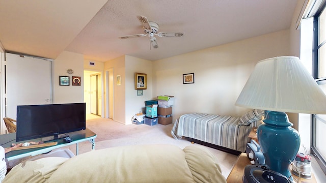 bedroom featuring light carpet and ceiling fan