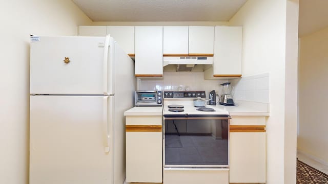 kitchen with white appliances, white cabinetry, backsplash, and a textured ceiling