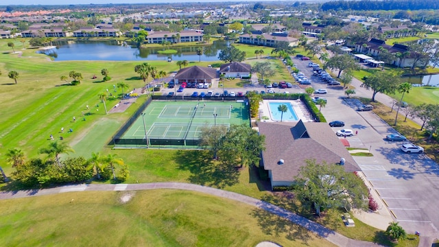 birds eye view of property with a water view