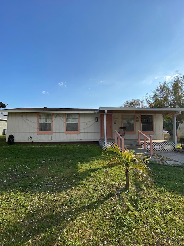 view of front of home with a front lawn and a porch