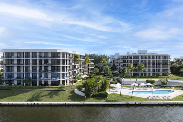 view of apartment building / complex featuring a water view