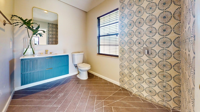 bathroom featuring vanity and toilet