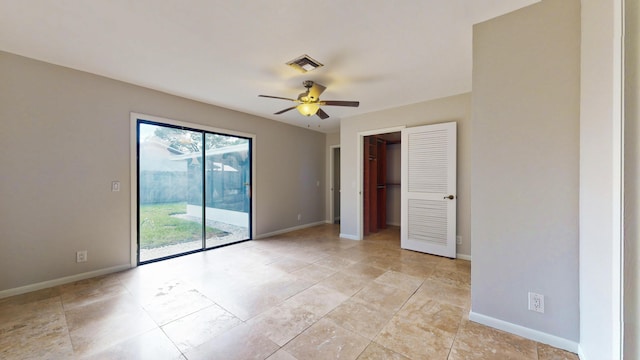 spare room with ceiling fan