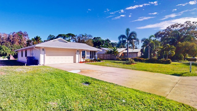 ranch-style house with a front yard and a garage